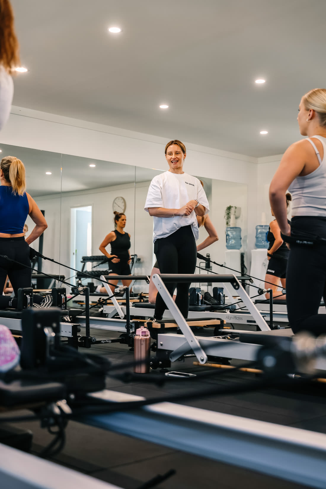 Steph laughing with the class between exercises in the studio